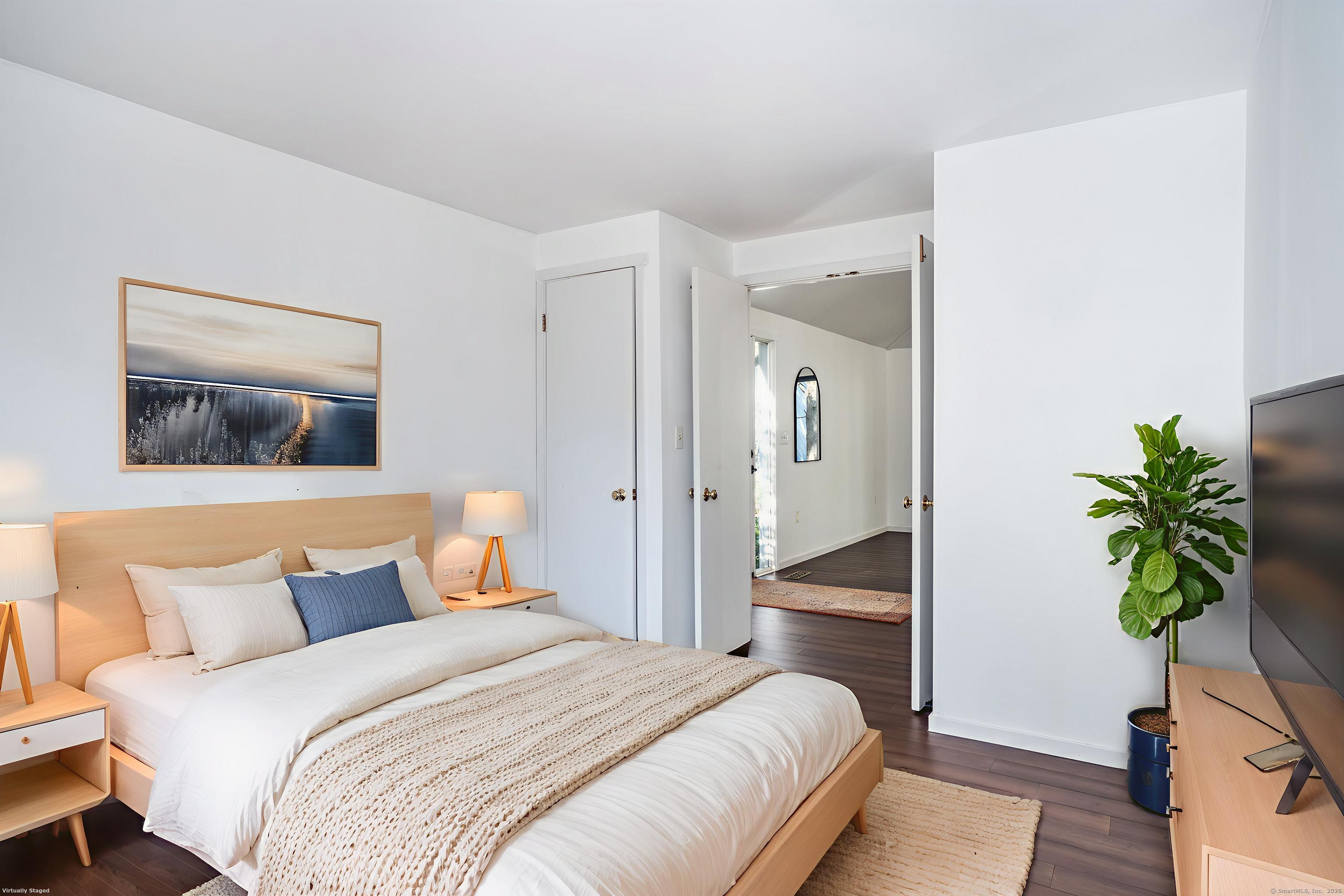 1 Morningside Court, Unit 1 Avon, CT 06001 - Photo 20 of 31 a bedroom with bed and a potted plant