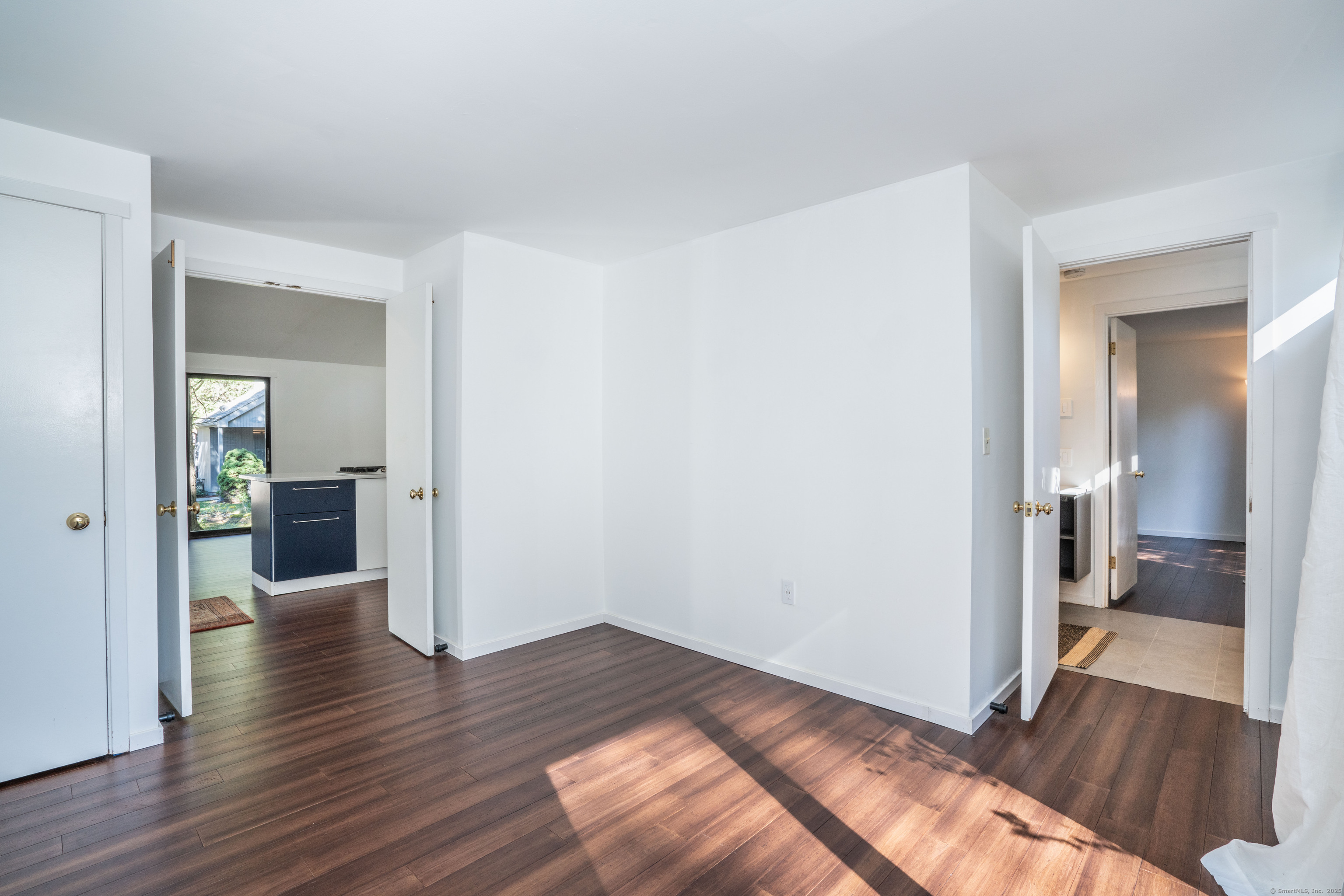 1 Morningside Court, Unit 1 Avon, CT 06001 - Photo 22 of 31 a view of a hallway with wooden floor and a bathroom