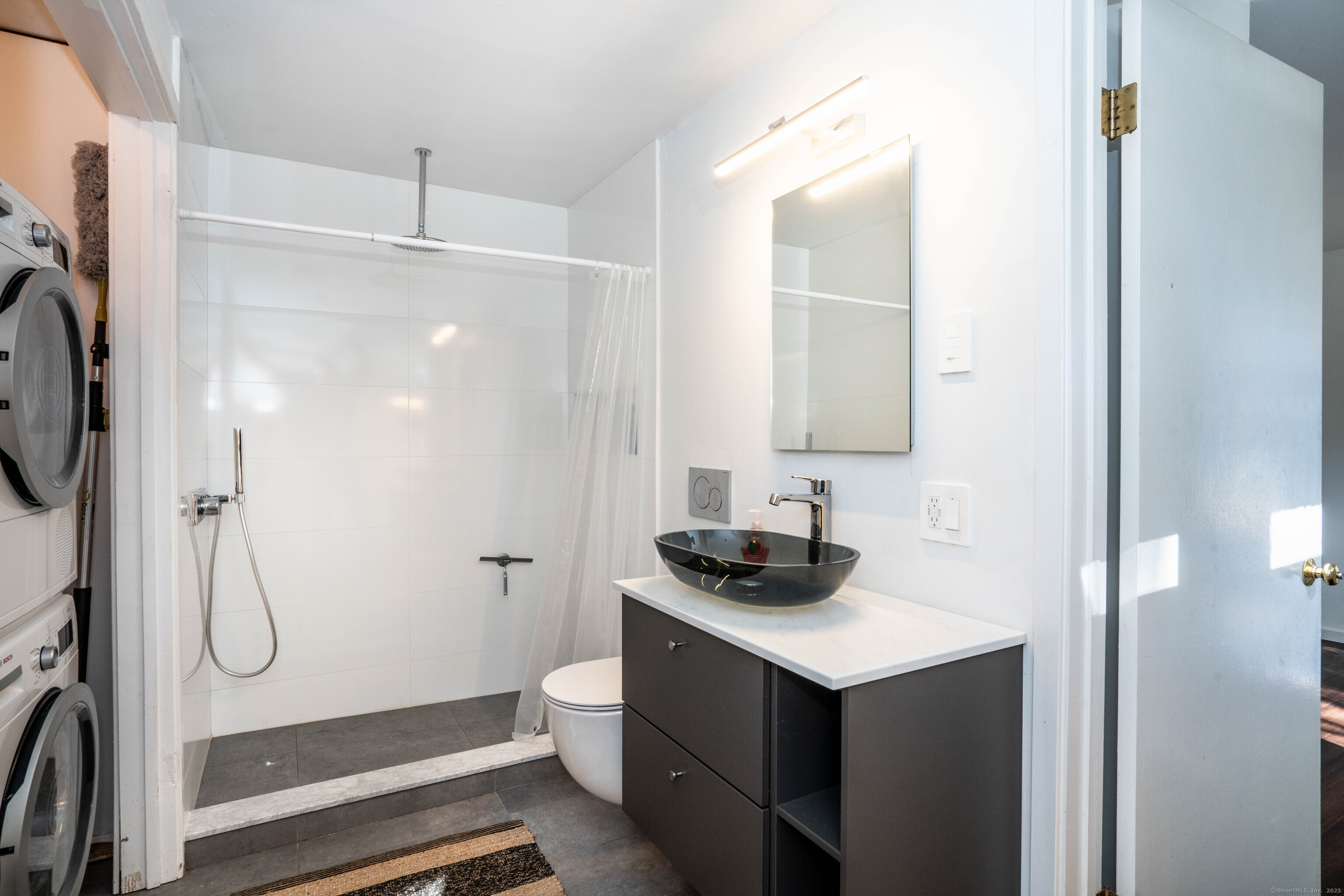 1 Morningside Court, Unit 1 Avon, CT 06001 - Photo 23 of 31 a bathroom with a sink a toilet and shower