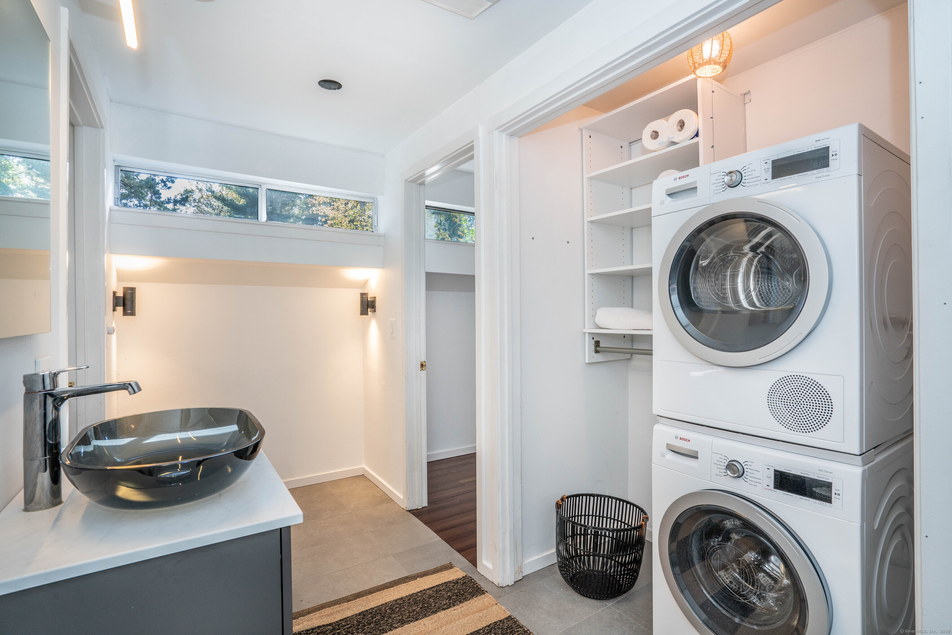 1 Morningside Court, Unit 1 Avon, CT 06001 - Photo 24 of 31 a utility room with dryer washer and a view of living room