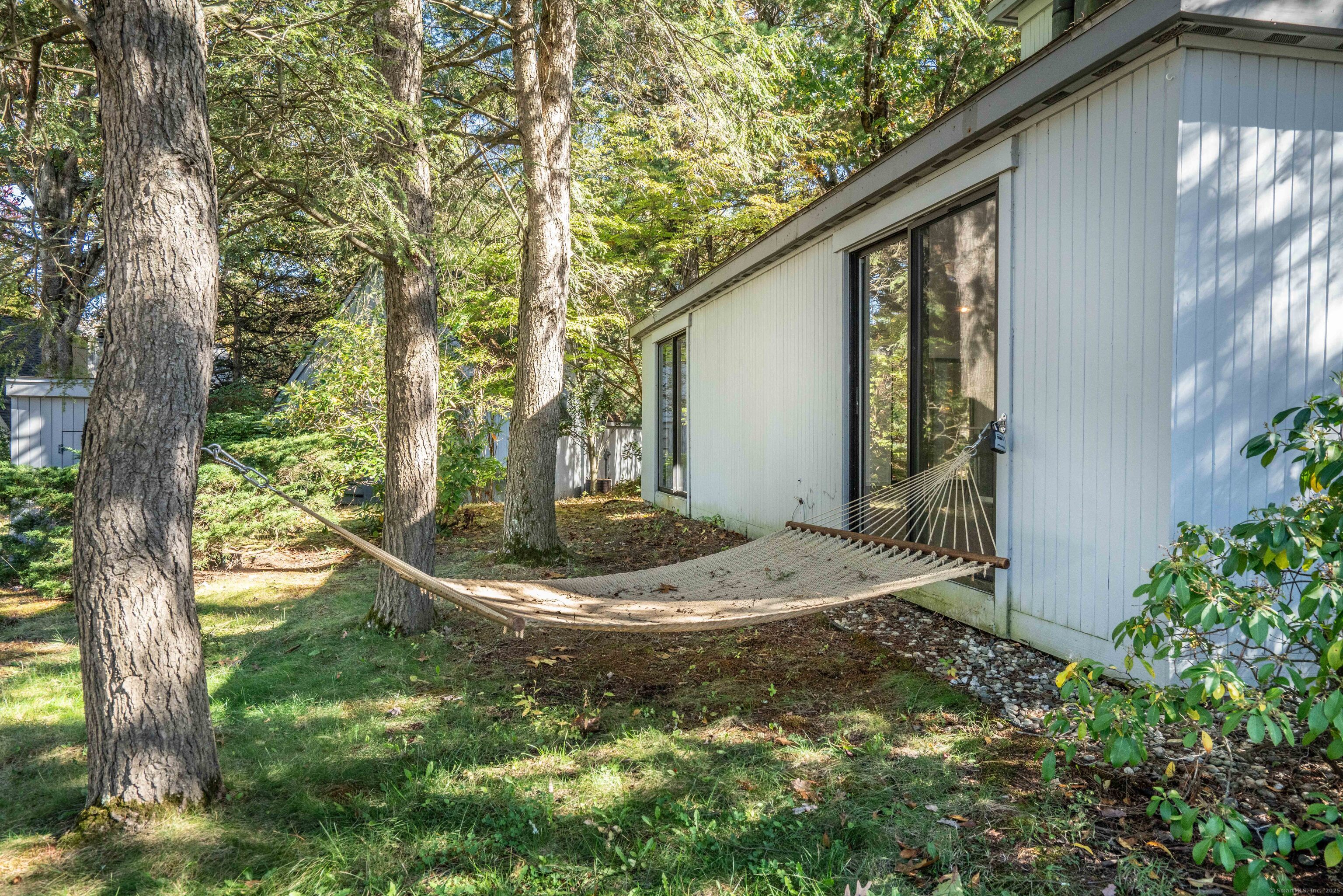 1 Morningside Court, Unit 1 Avon, CT 06001 - Photo 26 of 31 a backyard of a house with lots of green space