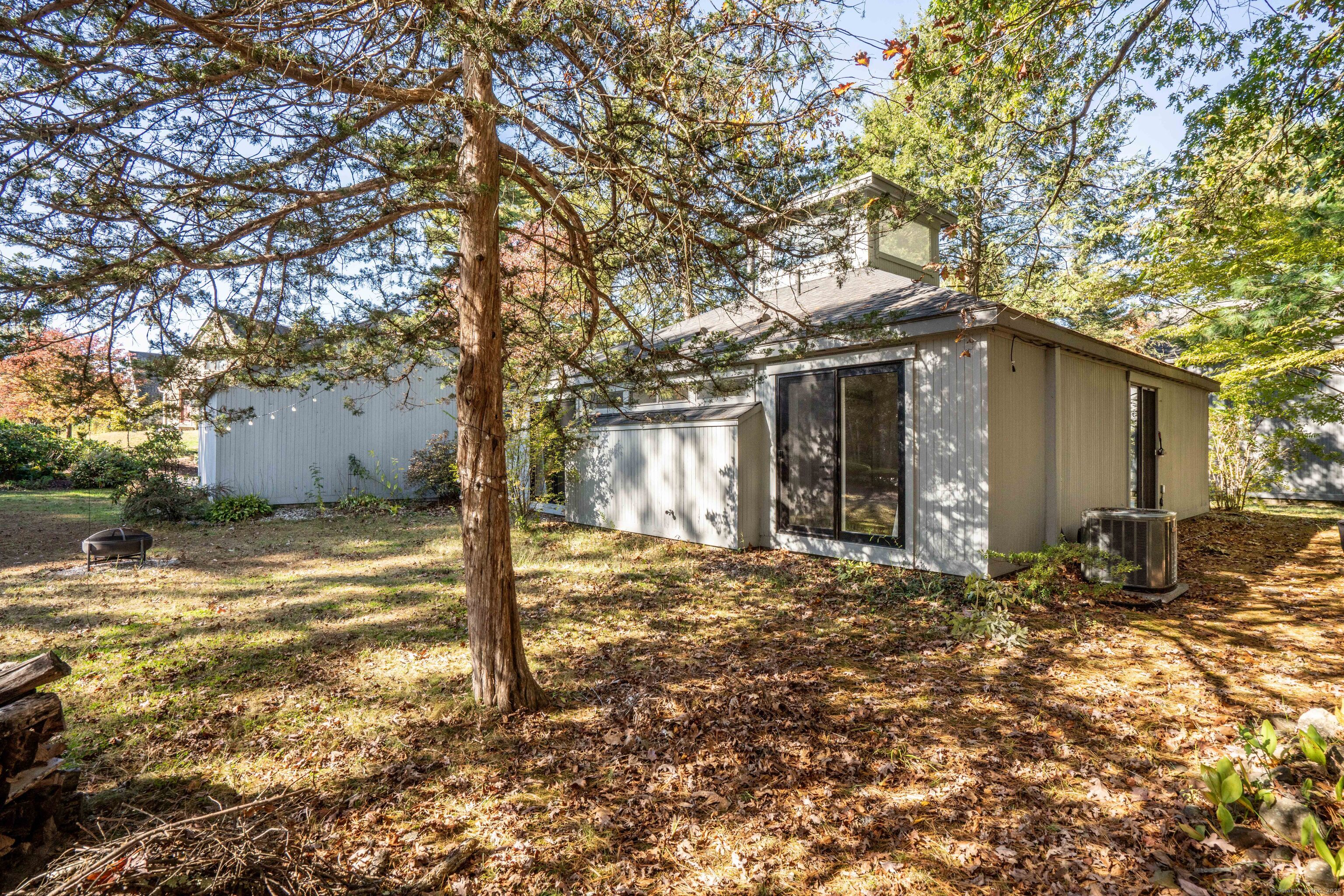 1 Morningside Court, Unit 1 Avon, CT 06001 - Photo 29 of 31 a tree in front of a white house