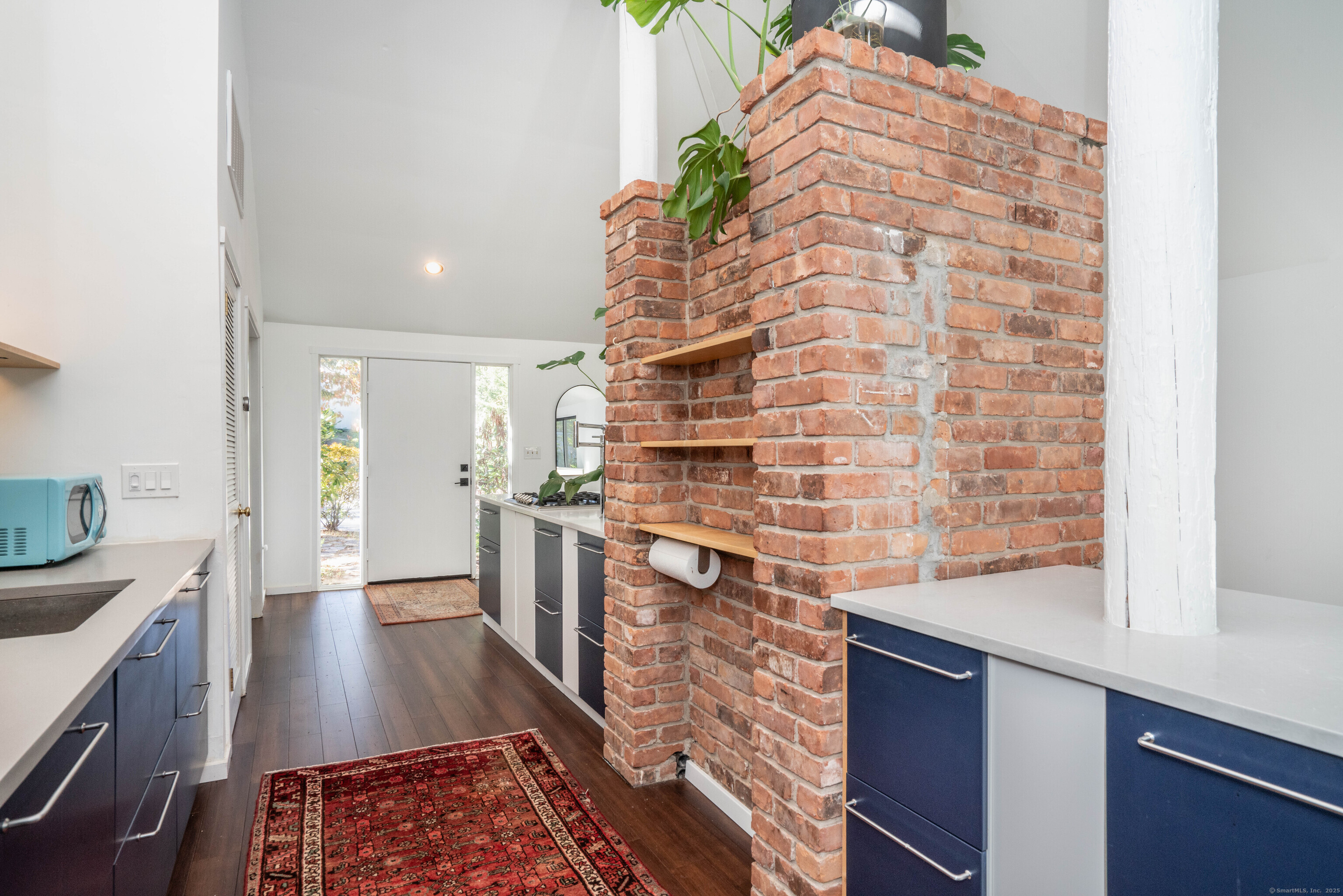 1 Morningside Court, Unit 1 Avon, CT 06001 - Photo 4 of 31 a living room with stainless steel appliances furniture a rug and a kitchen view