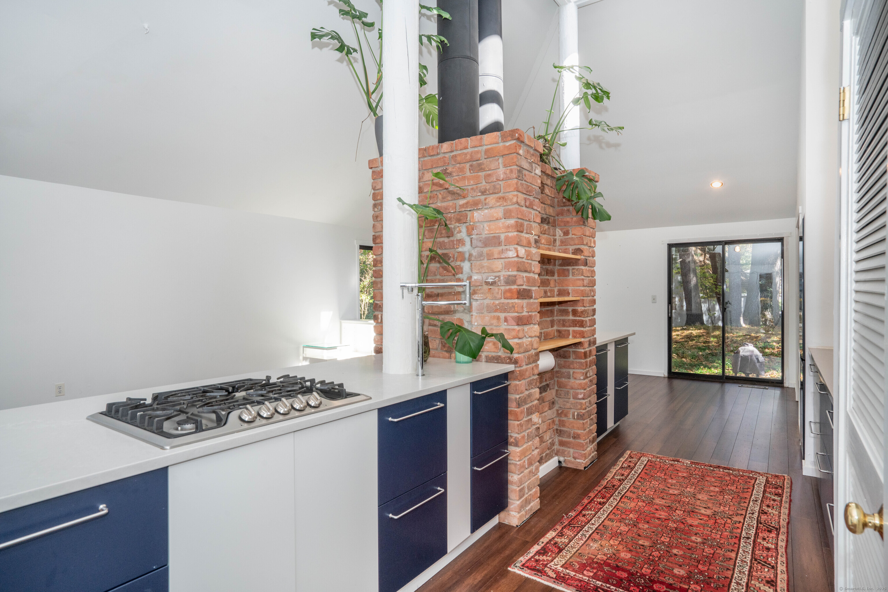 1 Morningside Court, Unit 1 Avon, CT 06001 - Photo 8 of 31 a kitchen with stainless steel appliances granite countertop a stove a sink and a refrigerator
