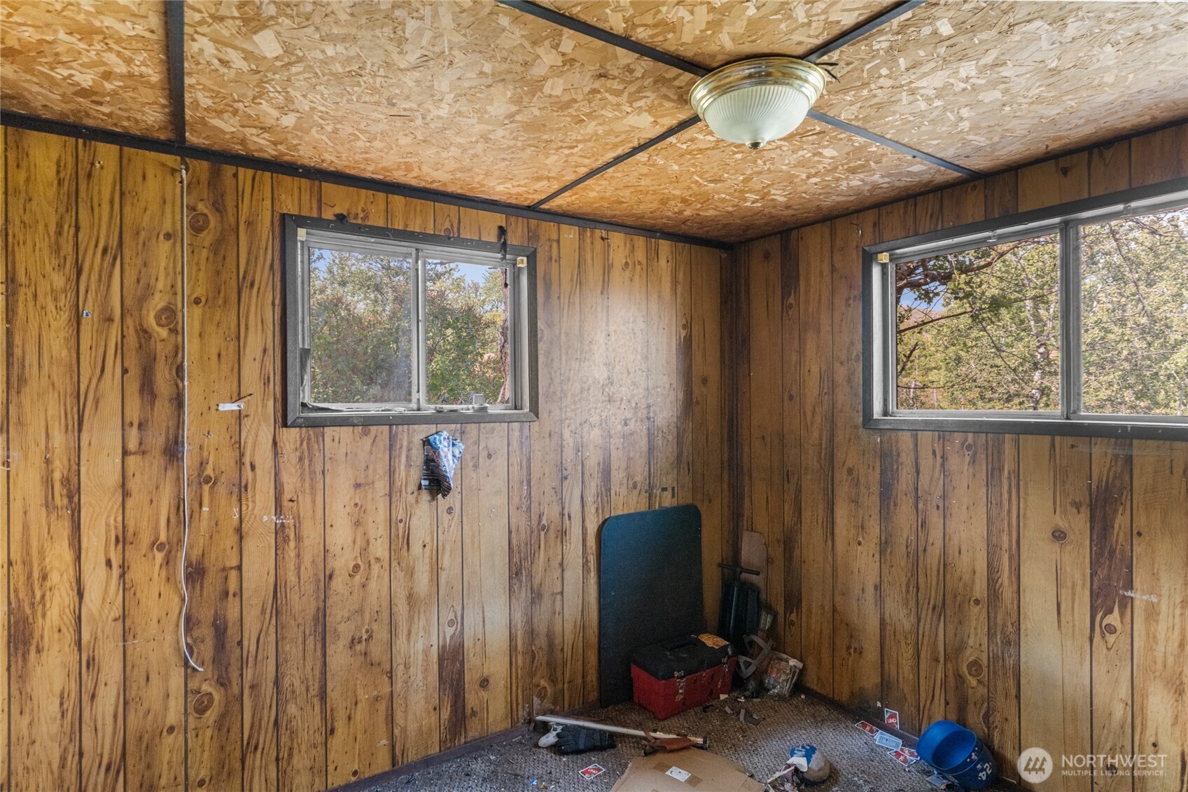 653 B Ellemeham Mountain Road Oroville, WA 98844 - Photo 13 of 33 a view of a workspace with furniture and a window