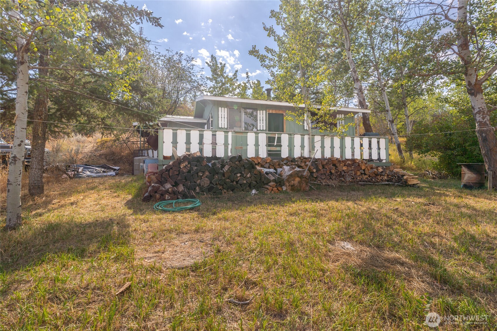 653 B Ellemeham Mountain Road Oroville, WA 98844 - Photo 2 of 33 a front view of a house with a yard