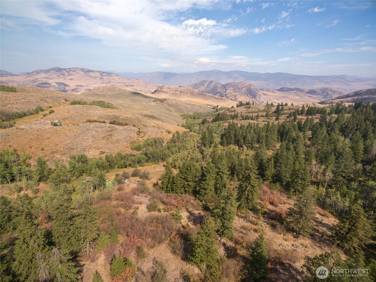 653 B Ellemeham Mountain Road Oroville, WA 98844 - Photo 25 of 33 an aerial view of residential houses with outdoor space