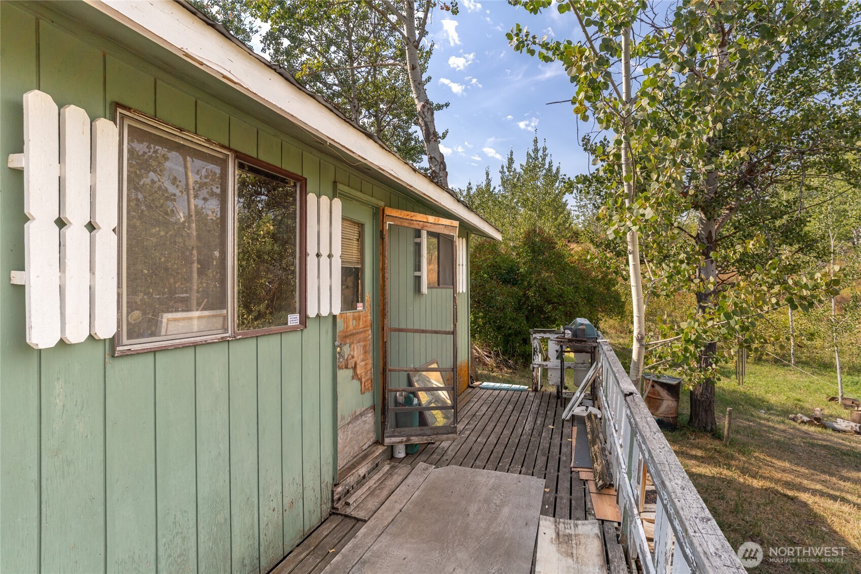 653 B Ellemeham Mountain Road Oroville, WA 98844 - Photo 3 of 33 a view of a house with backyard and sitting area