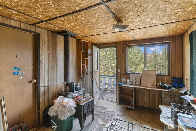 a room with furniture and floor to ceiling window