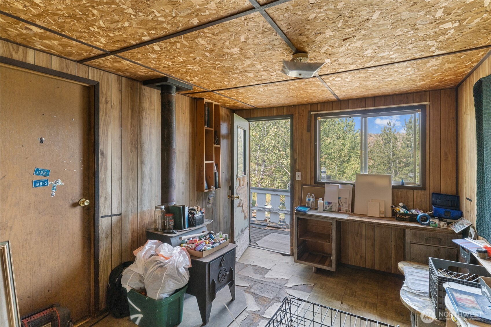 653 B Ellemeham Mountain Road Oroville, WA 98844 - Photo 10 of 33 a room with furniture and floor to ceiling window