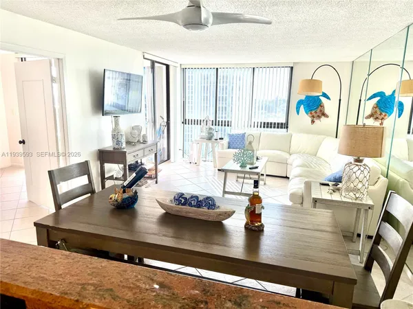 a view of a dining room with furniture window and outside view
