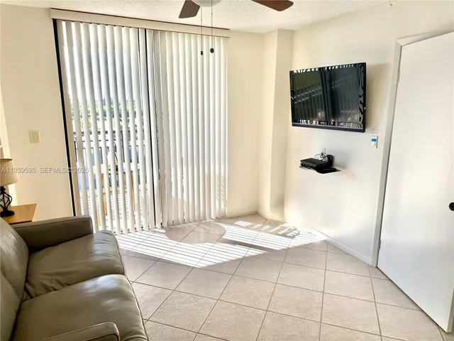 a living room with a couch and a flat screen tv