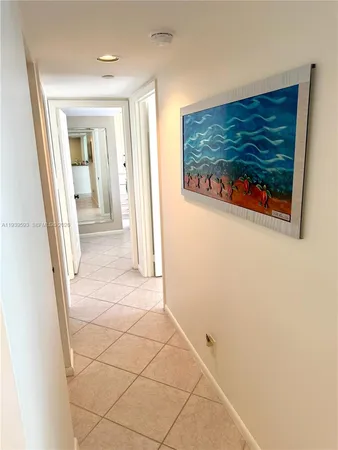 view of a room with wooden floor and a rug