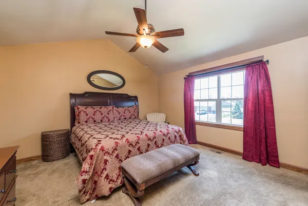 a bed room with a bed and a window