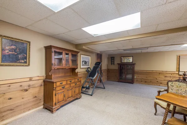 a view of a bedroom with furniture