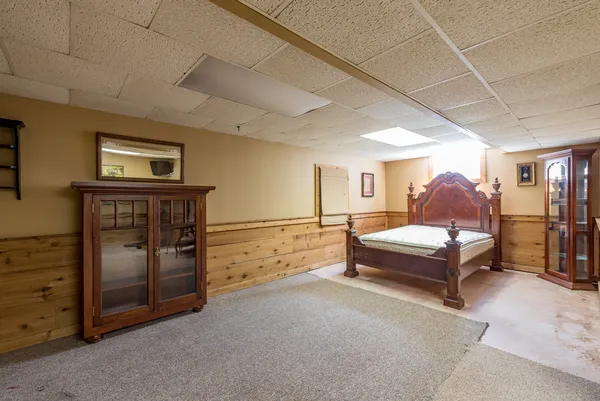 a spacious bedroom with a bed and a walk in closet