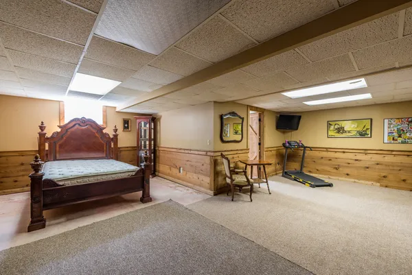 a bedroom with furniture and a couch