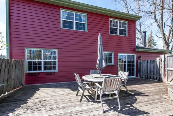 a table and chairs in front of a house