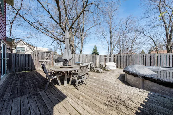 a view of a wooden deck with furniture