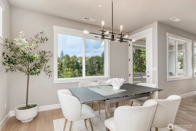 a view of a dining room with furniture window and outside view