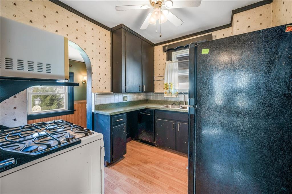 6 East Ridge Avenue Greenville, PA 16125 - Photo 13 of 47 a kitchen with stainless steel appliances granite countertop a stove and a refrigerator
