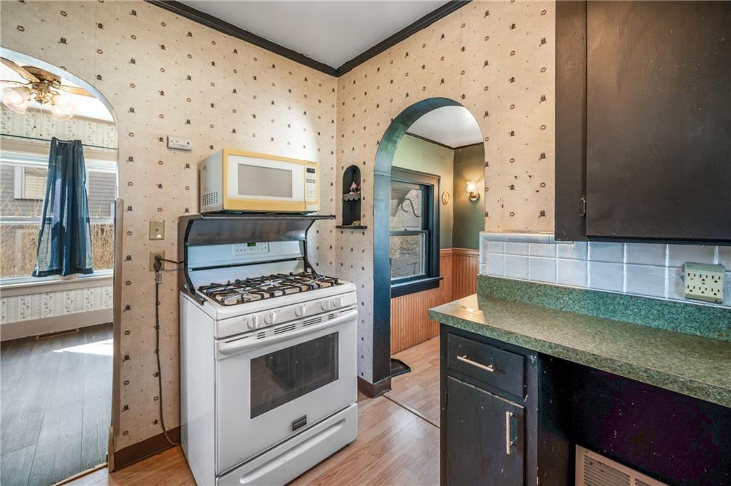 6 East Ridge Avenue Greenville, PA 16125 - Photo 15 of 47 a kitchen with granite countertop a stove and a sink