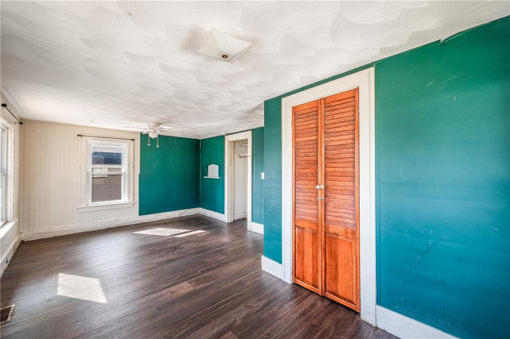 6 East Ridge Avenue Greenville, PA 16125 - Photo 22 of 47 a view of an empty room with wooden floor and a window