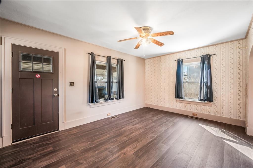 6 East Ridge Avenue Greenville, PA 16125 - Photo 4 of 47 a view of an empty room with wooden floor and a window
