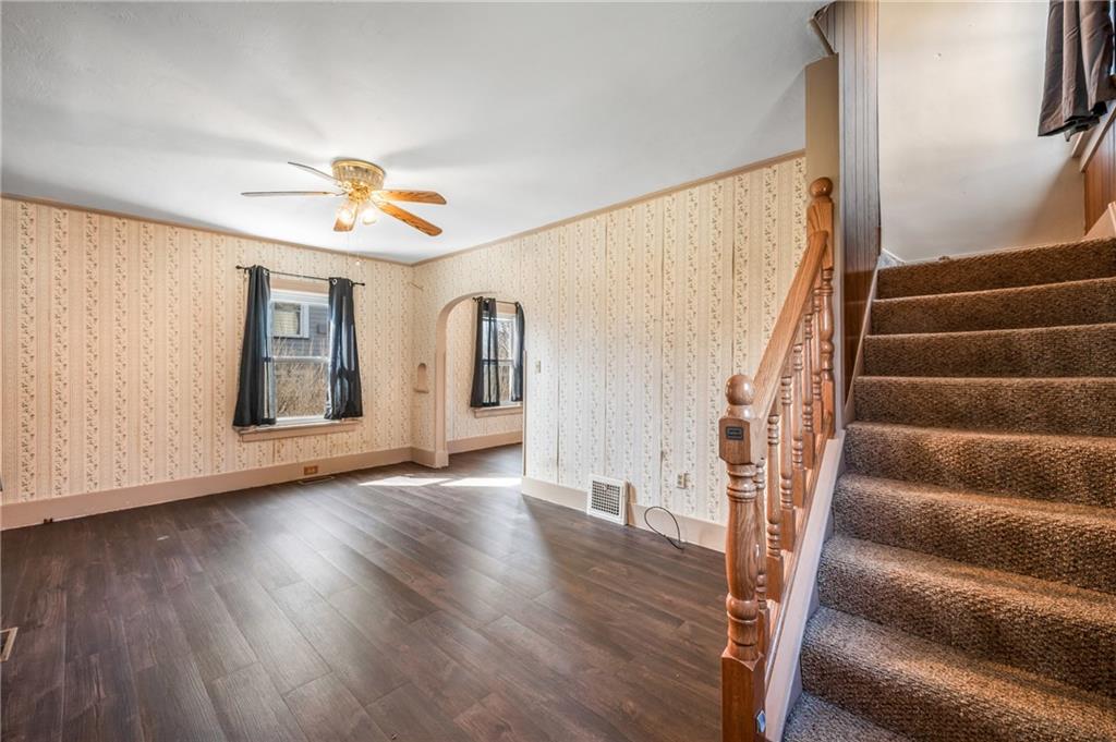 6 East Ridge Avenue Greenville, PA 16125 - Photo 5 of 47 a view of an empty room with wooden floor and fan