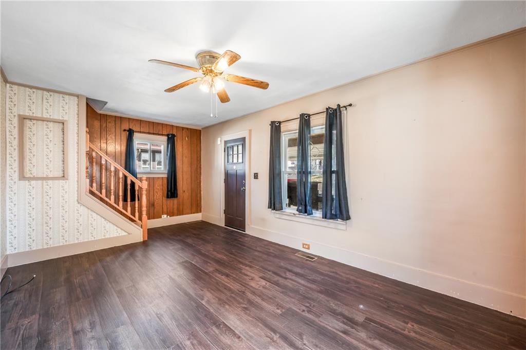 6 East Ridge Avenue Greenville, PA 16125 - Photo 6 of 47 a view of an empty room with wooden floor and a window