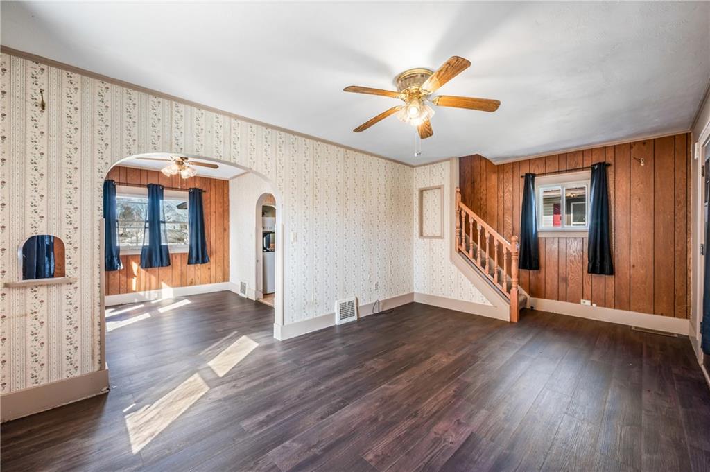 6 East Ridge Avenue Greenville, PA 16125 - Photo 7 of 47 a view of a livingroom with wooden floor and a ceiling fan