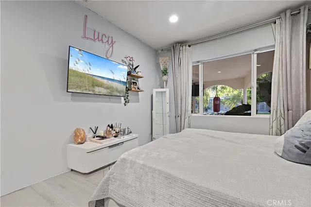 a bedroom with a bed and a fireplace