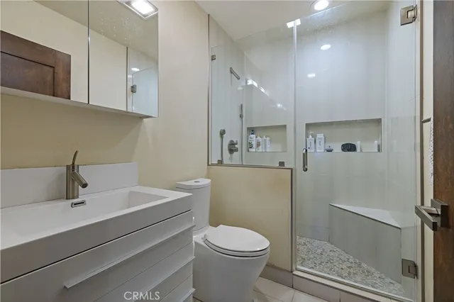 a spacious bedroom with a bed and a fireplace