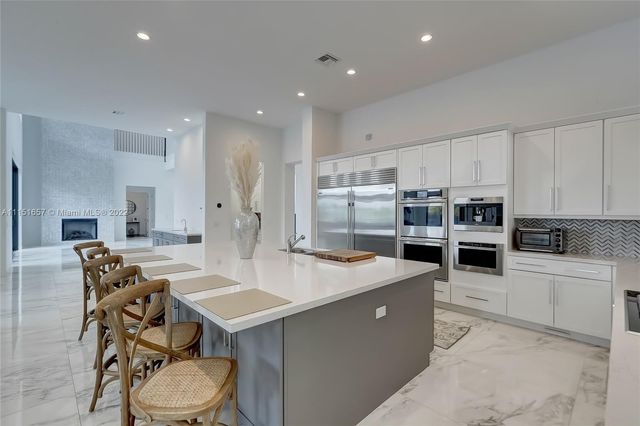 a view of a room with gym equipment and a large window