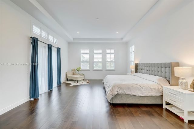 a bathroom with a granite countertop sink mirror and shower