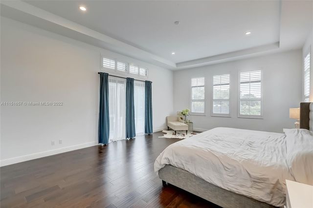 a large bathroom with a granite countertop sink mirror and shower