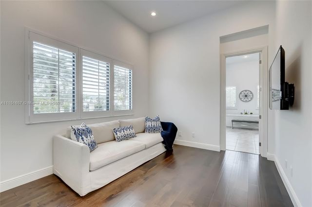 a bathroom with a tub a sink shower and mirror