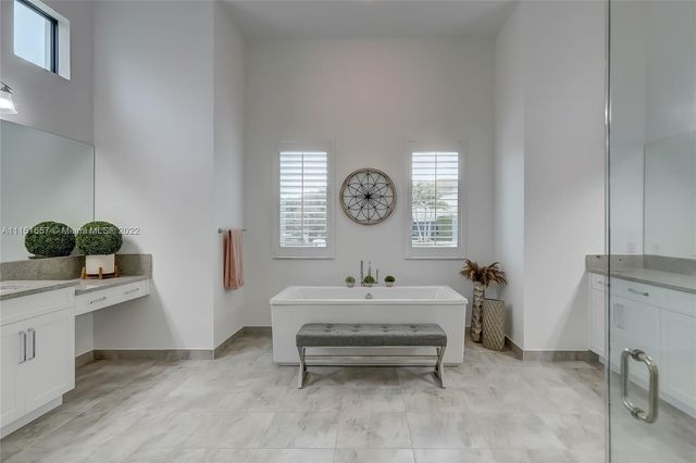a bathroom with a sink a toilet and a shower