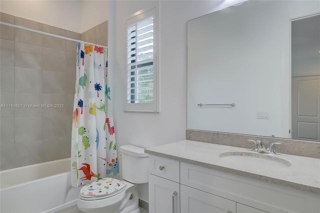 a view of a livingroom with wooden floor and stairs