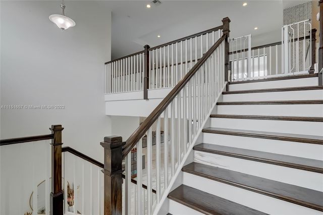 a view of house with swimming pool yard and outdoor seating