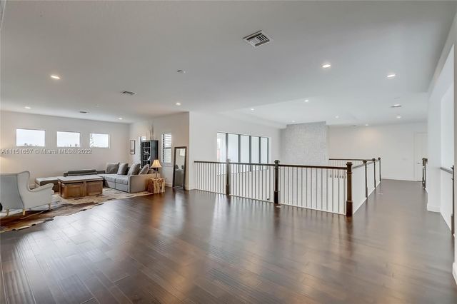 an aerial view of a house with a yard pool outdoor seating and yard