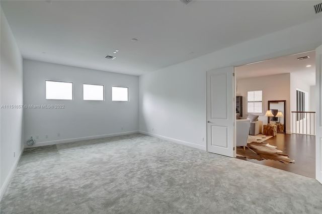 an aerial view of a house with a swimming pool outdoor seating and yard