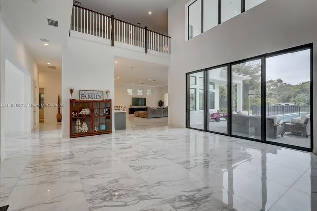 a view of an empty room with a fireplace