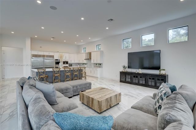a living room with furniture and a couch