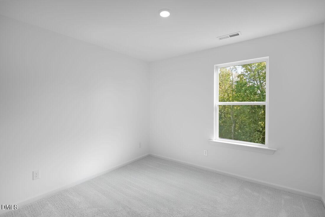 430 Rowe Way Knightdale, NC 27545 - Photo 21 of 51 an empty room with a window