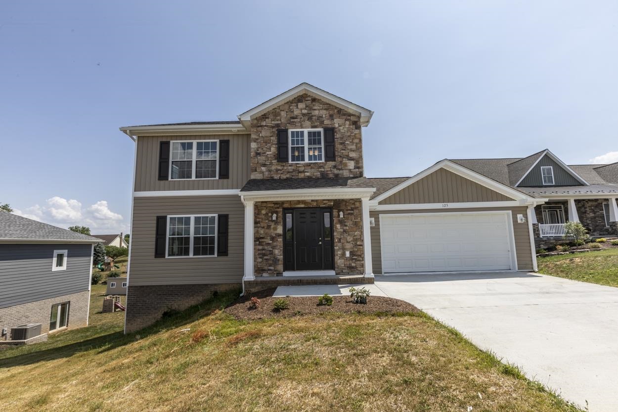 125 Rhodes Hill Drive Dayton, VA 22821 - Photo 1 of 37 a front view of a house with a yard and garage