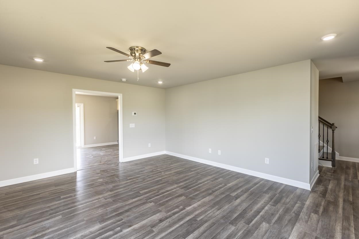 125 Rhodes Hill Drive Dayton, VA 22821 - Photo 12 of 37 a view of an empty room with wooden floor and a ceiling fan