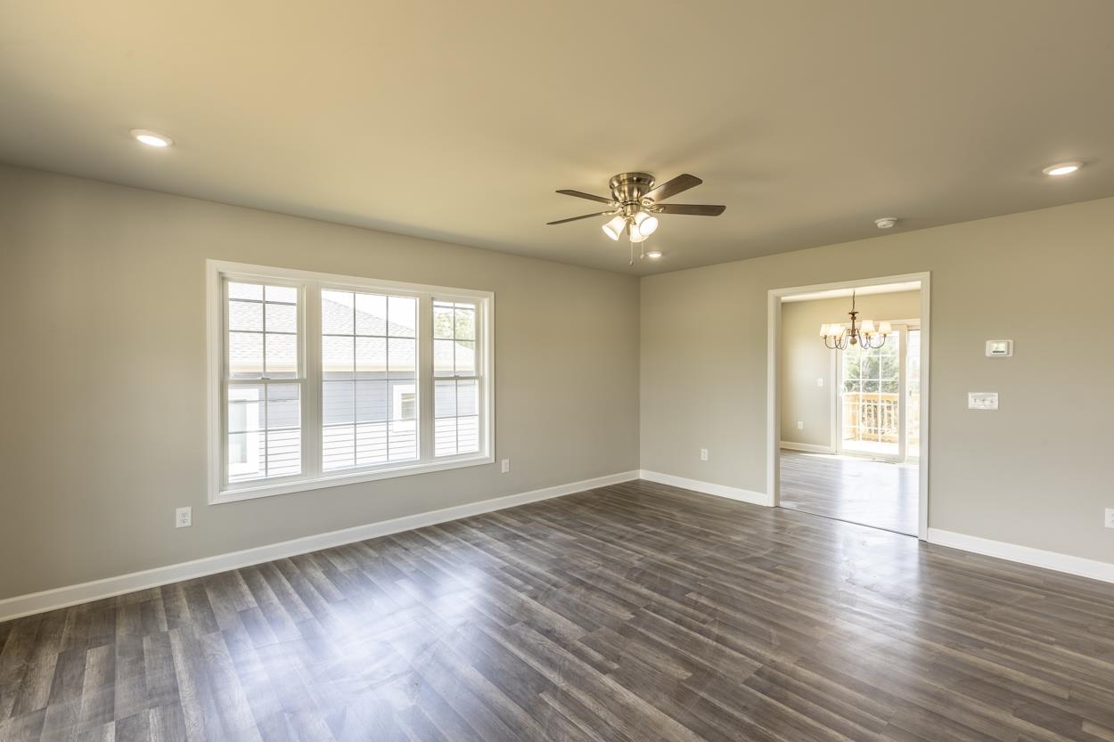 125 Rhodes Hill Drive Dayton, VA 22821 - Photo 13 of 37 an empty room with wooden floor and windows