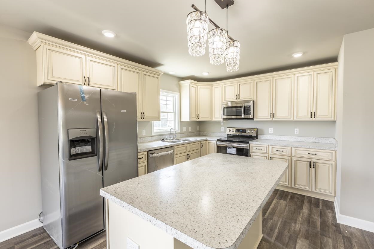 125 Rhodes Hill Drive Dayton, VA 22821 - Photo 14 of 37 a kitchen with stainless steel appliances granite countertop a refrigerator a sink dishwasher a stove and white cabinets with wooden floor