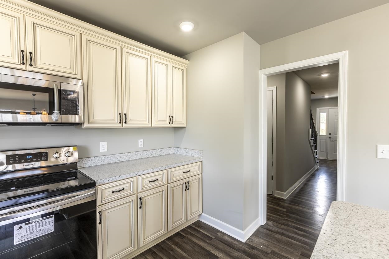 125 Rhodes Hill Drive Dayton, VA 22821 - Photo 16 of 37 a kitchen with stainless steel appliances granite countertop a stove and a microwave